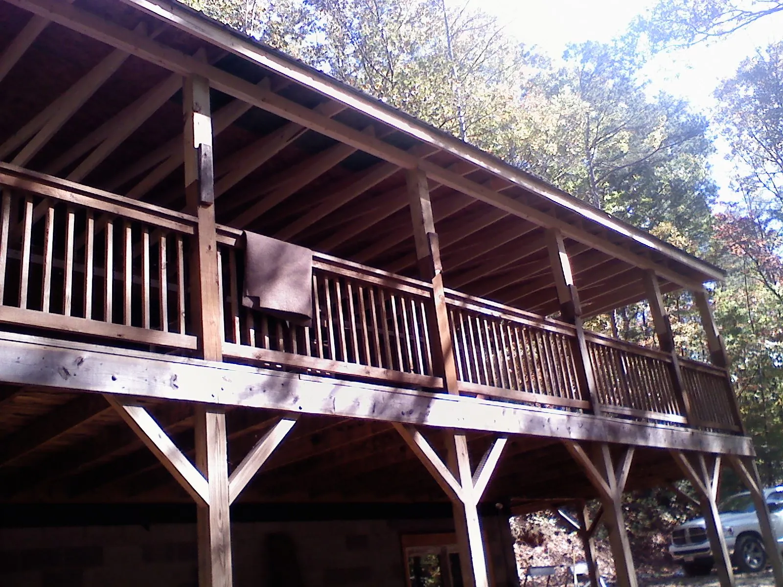 Timber framing under a new elevated porch and deck — Roof Leak Repair in Rives Junction by Roofing Brothers